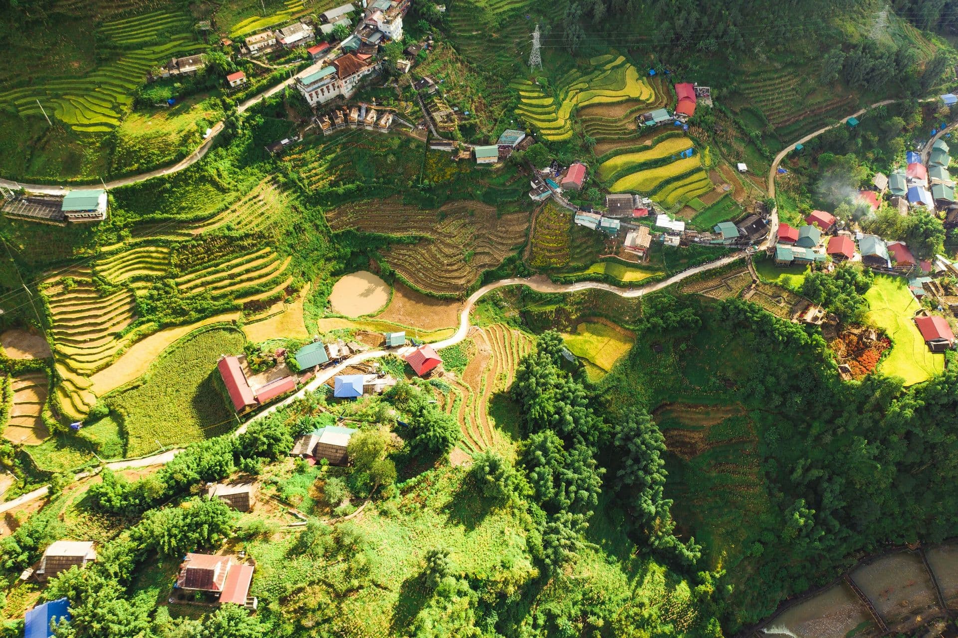Rice terraces and a village seen from above in the mountains of northern Vietnam